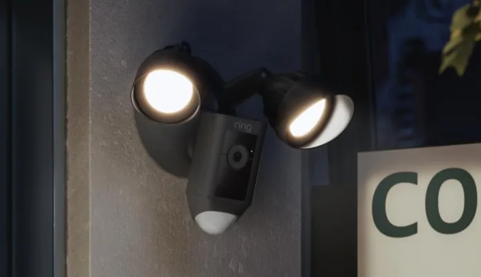 Outdoor security camera with dual floodlights.