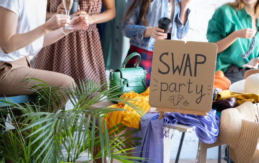 Clothing swap party with drinks and friends.