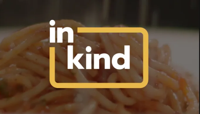 Spaghetti behind 'in kind' logo graphic.