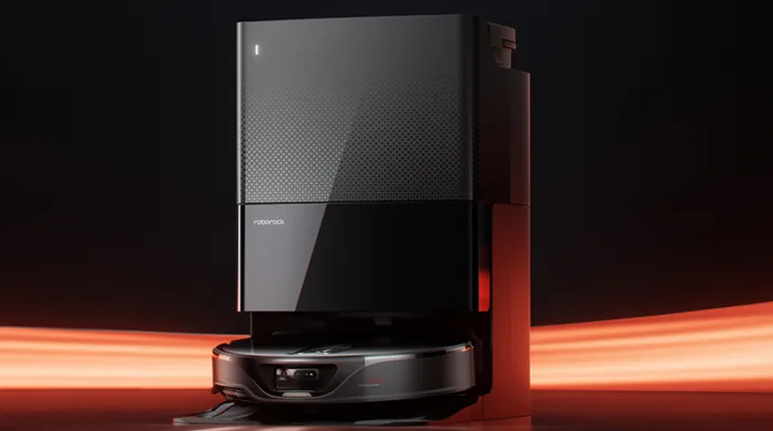 Robotic vacuum cleaner with sleek dock and lighting.