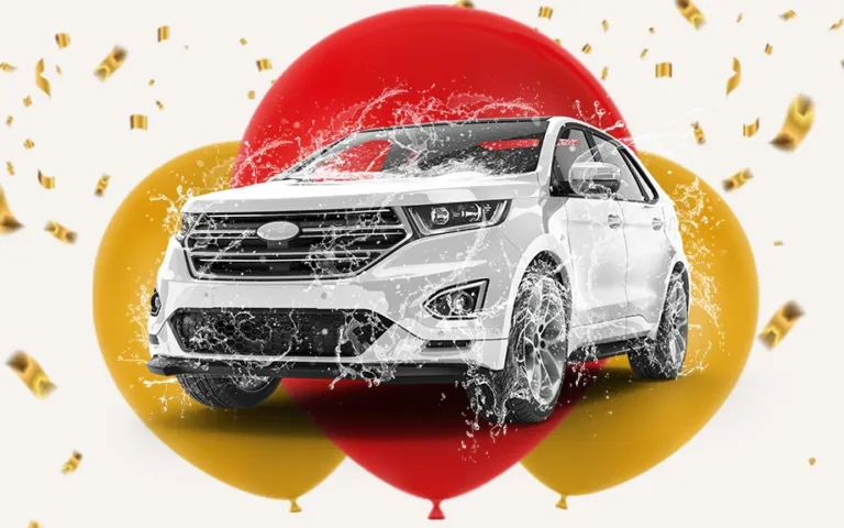 White SUV with balloons and confetti background.