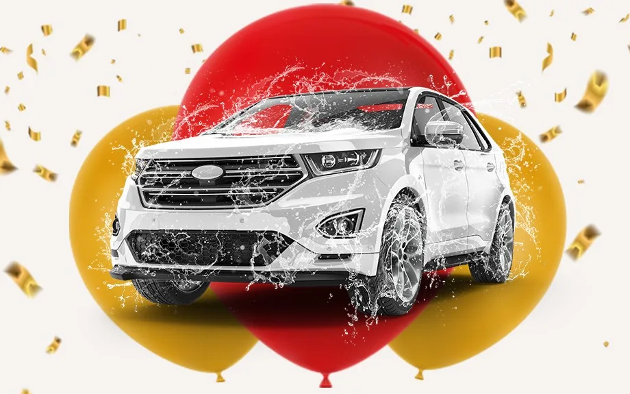 White SUV with balloons and confetti background.