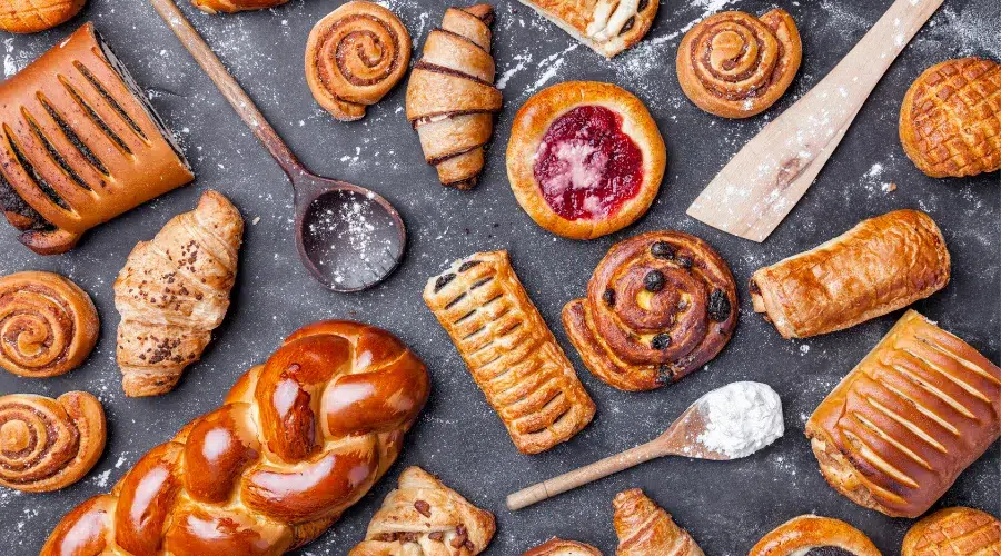 Assorted pastries on a dark surface.