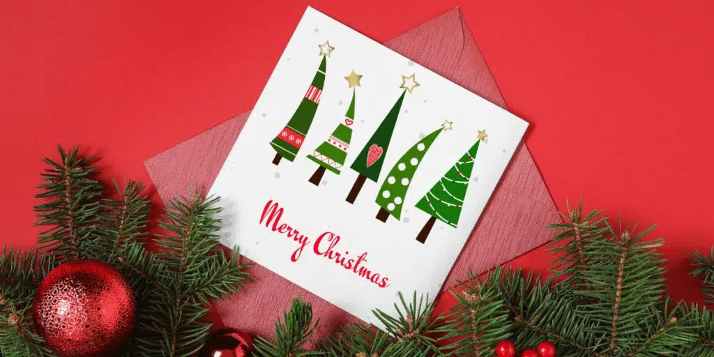 Christmas card with trees and Merry Christmas text