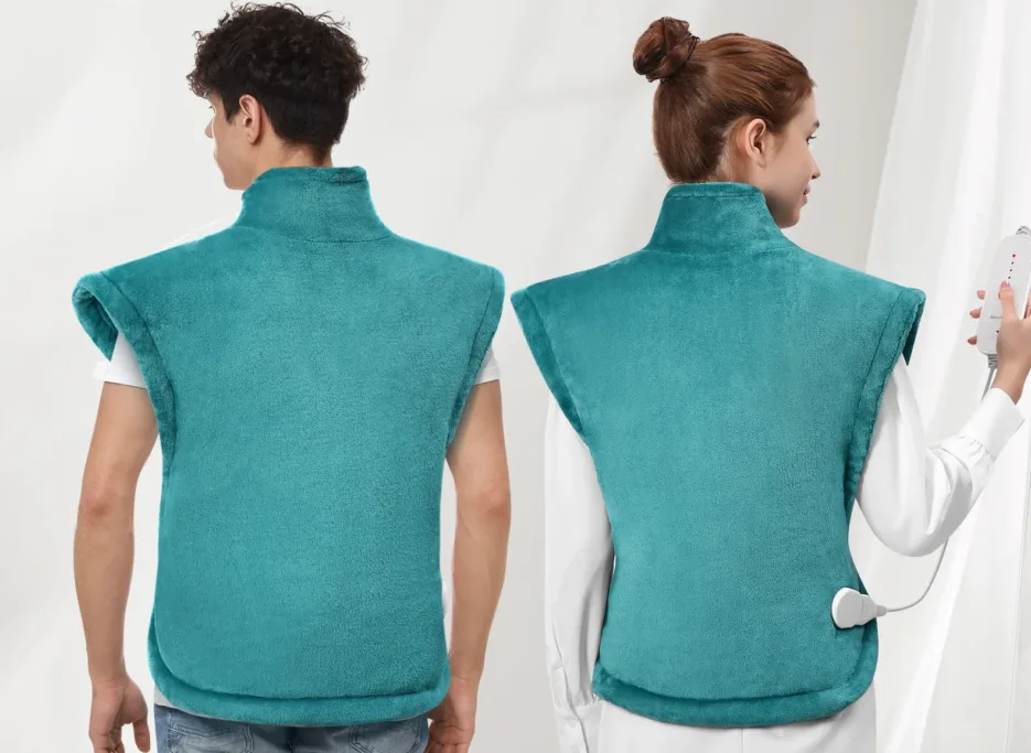 Two people wearing teal heated vests, back view.