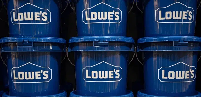 Blue Lowe's buckets stacked in store display.