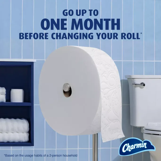 Extra-large toilet paper roll in bathroom.