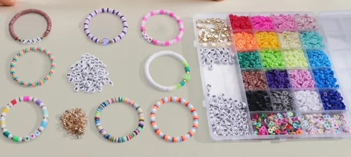 Colorful bracelet making kit with letter beads displayed.
