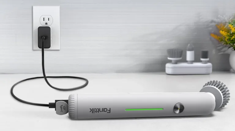 Electric cleaning brush charging on countertop