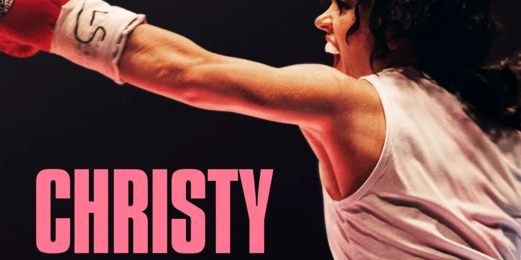 Female boxer throws punch in ring.