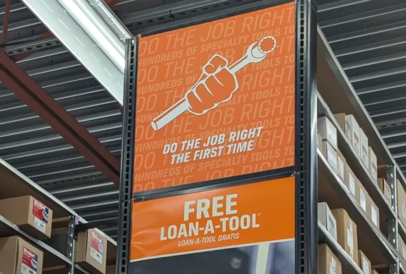 Tool rental service sign at store aisle.