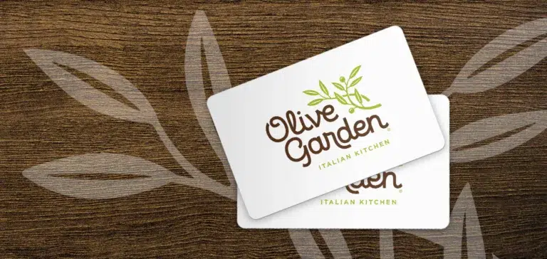 Olive Garden gift cards on wooden background.