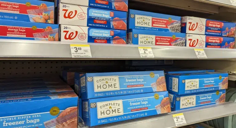 Freezer and storage bags displayed on store shelf.