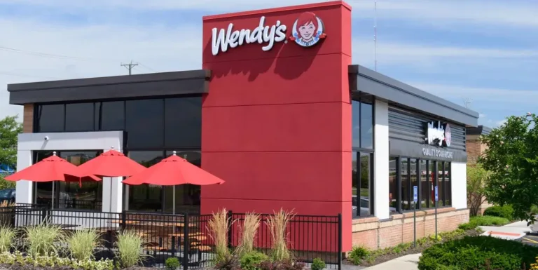 Wendy's restaurant exterior with red umbrellas.