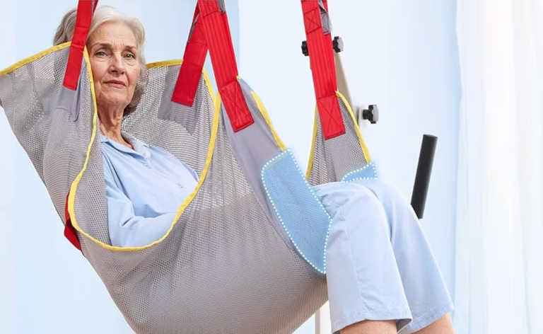 Elderly woman in upgraded patient sling with support.