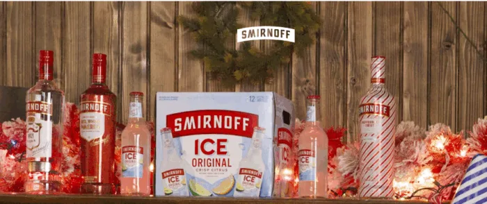 Smirnoff beverages displayed on festive holiday shelf.