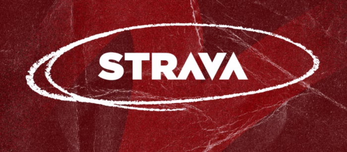 Strava logo on textured red background