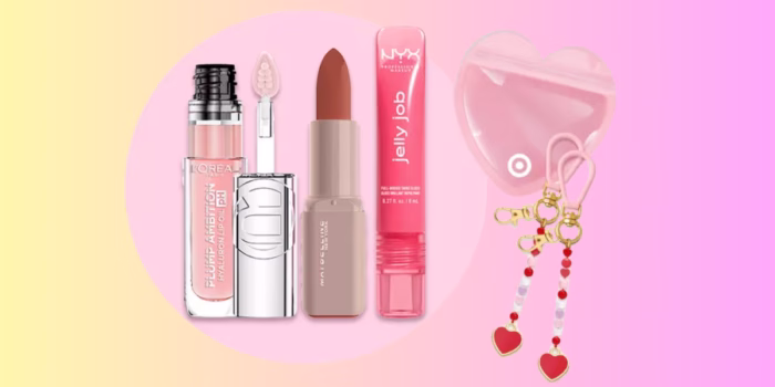 Makeup products and heart accessories on colorful background.