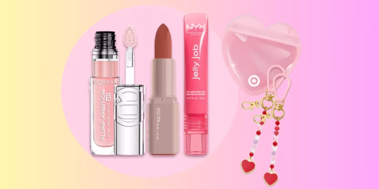 Makeup products and heart accessories on colorful background.
