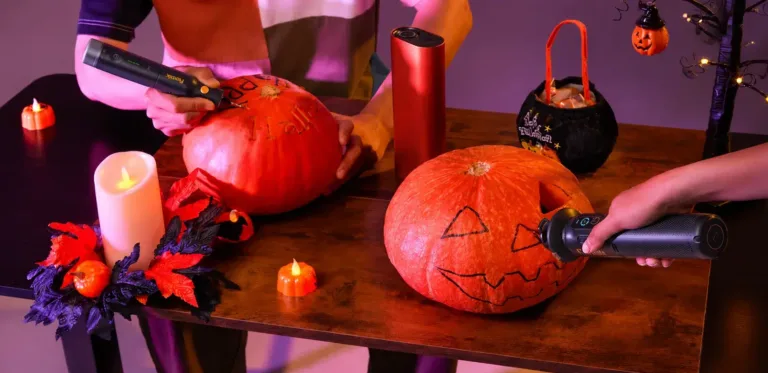 Halloween Pumpkin Carving Under Purple Lights e1793036911225 Halloween Pumpkin Carving Under Purple Lights e1793036911225